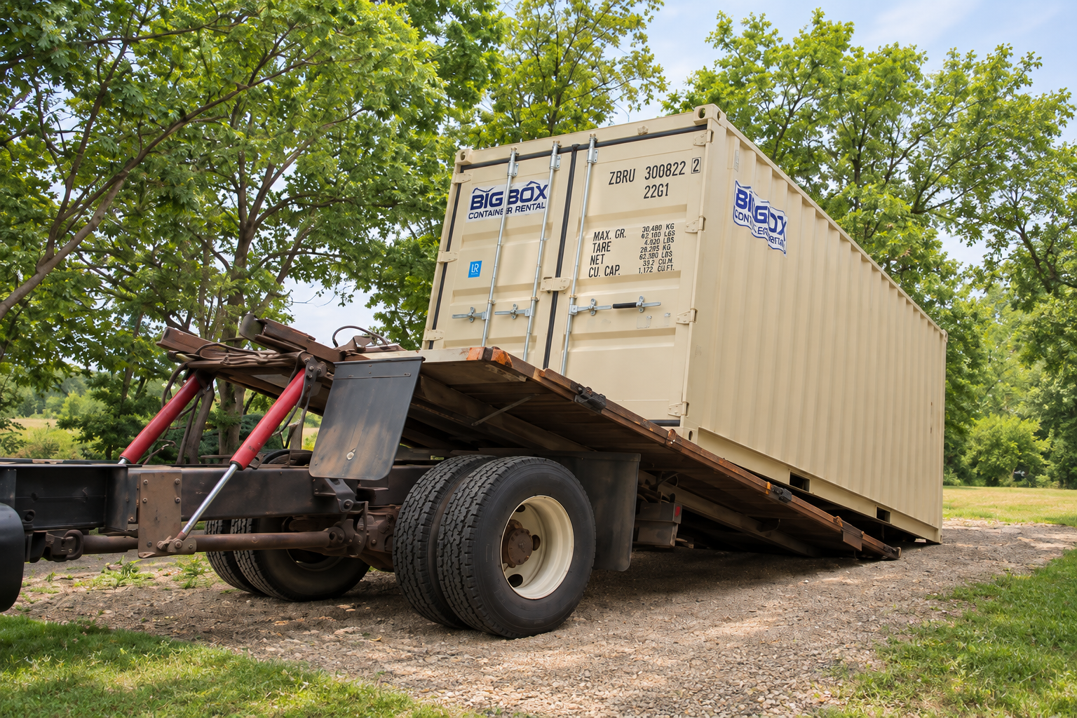 20-foot storage container being delivered on a tilt-bed truck
